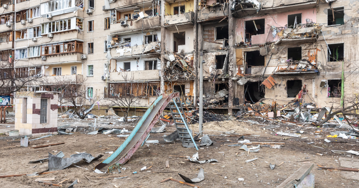 Children and War, Children's Slide in Front of Bomb Damaged Building