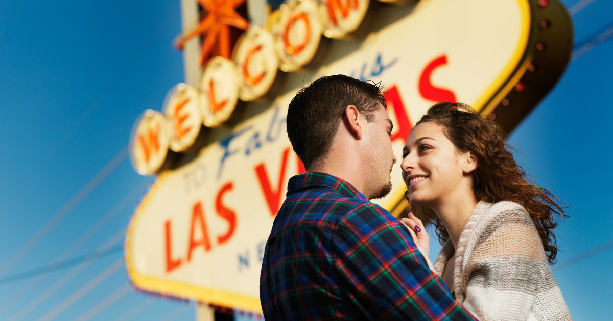 Couple in front of the Las Vegas sign