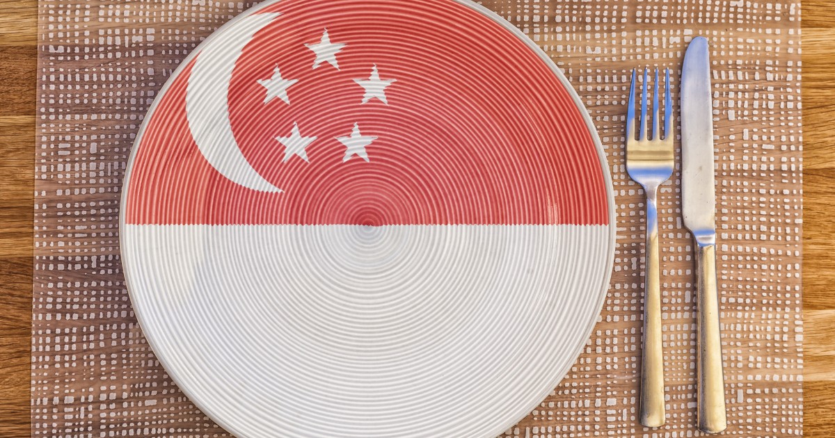 Dinner plate with the flag of Singapore on it for your international food and drink concepts.