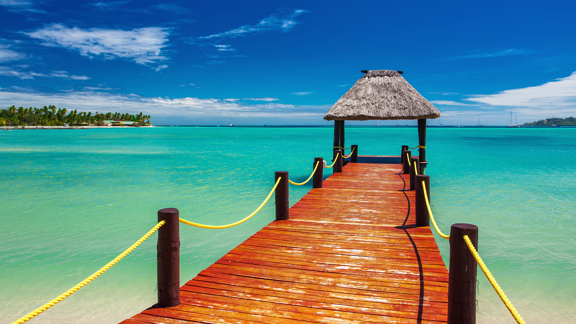 Destinations: Short Red Wooden Jetty Extending to Tropical Ocean, Fiji-Island, Oceania