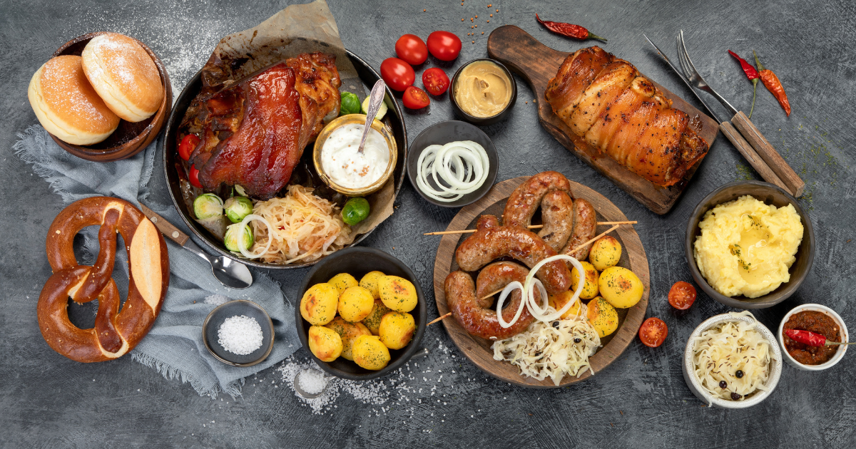 German cuisine on dark background. Traditional food concept. Grilled meat and snacks