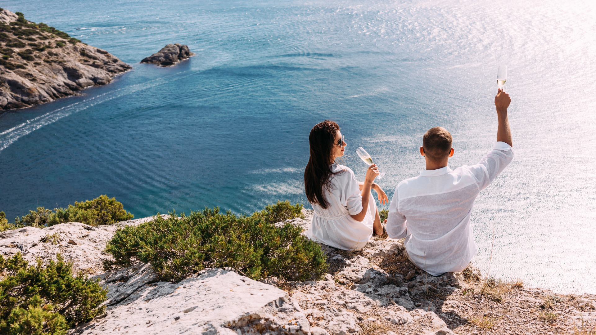 Honeymoon, Couple Drinking Champagne on a Cliff