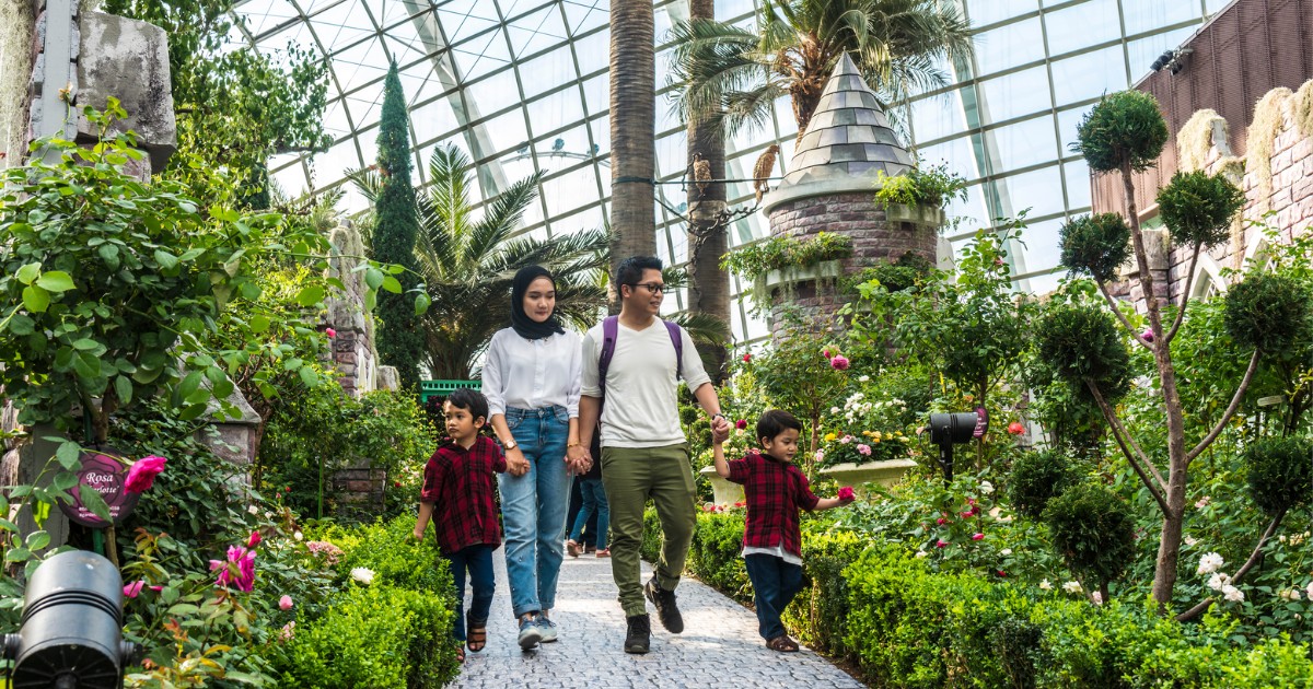 family with two male children enjoying time together in Garden By The Bay Flower Dome, Singapore